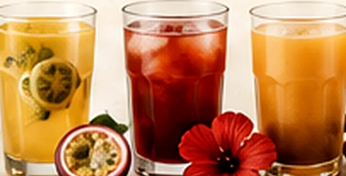 Glasses of fresh juice with passion fruit and hibiscus